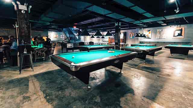 Bar at Sour Mouse NYC with pool tables for social gatherings and events.