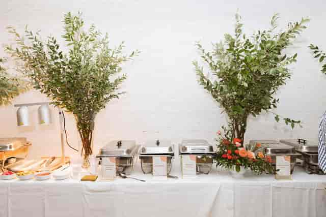 Elegant buffet setup with greenery in Loft, Garden House NYC for events.