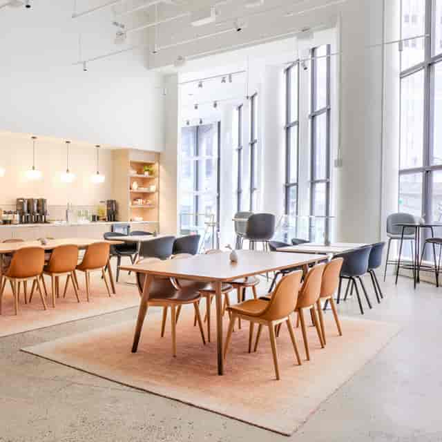 Modern meeting room with natural light for versatile business events at Convene 360 Madison.