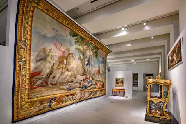Elegant gallery with exquisite tapestry, ideal for art events and private viewings.