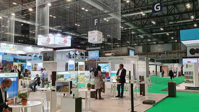 Bustling IFEMA MADRID exhibition hall with vendor booths for trade shows and networking.