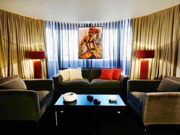 Sophisticated lounge at Puerta América Hotel for networking and informal meetings.
