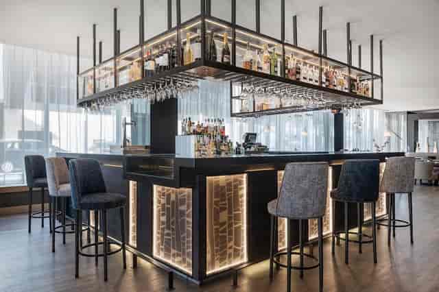 Modern bar at AC Hotel Madrid Feria, ideal for cocktail receptions and networking events.