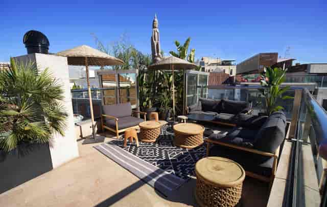 Stylish rooftop lounge at Hotel Urban, perfect for networking events and gatherings.