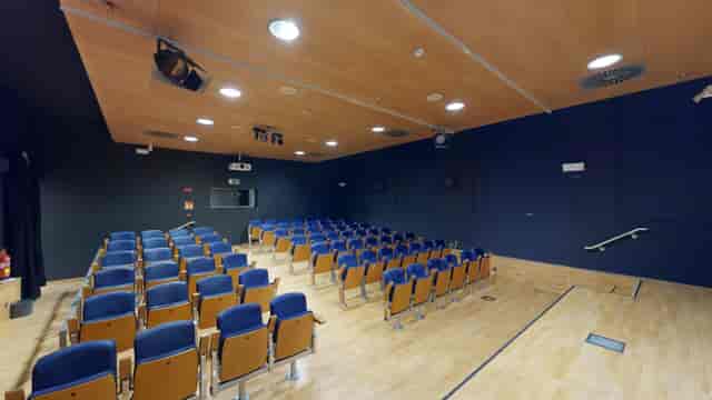 Screening room at La Casa Encendida with blue seating, ideal for lectures and events.