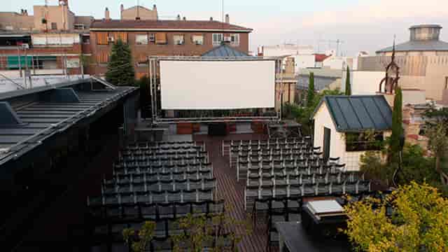 Outdoor venue at La Casa Encendida for presentations and screenings, featuring rows of chairs.