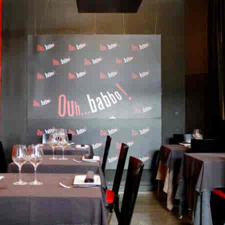 Stylish restaurant dining setup at Ouh...babbo, perfect for events and celebrations.
