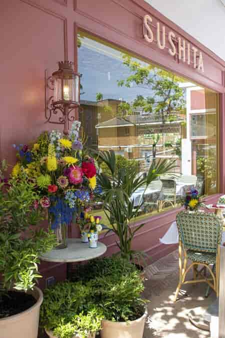 Elegant floral arrangement at La Madonna Sushita entrance for memorable events.
