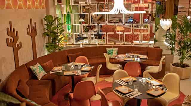 Vibrant dining space at Le Club for intimate gatherings and meetings.
