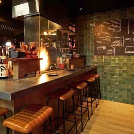 Stylish Japanese restaurant kitchen with bar seating, ideal for culinary events and workshops.