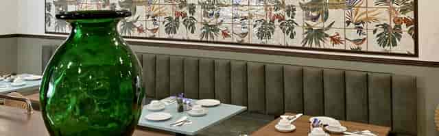 Intimate hotel bar with elegant decor, perfect for networking events and small meetings.