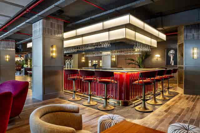 Stylish bar area in Radisson RED Madrid for networking and events.