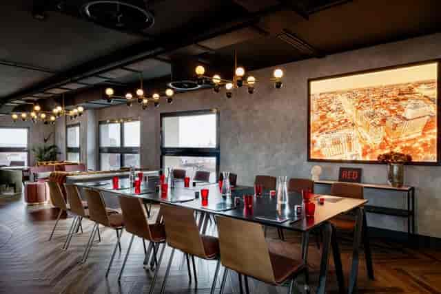 Modern meeting space at Radisson RED Madrid with sleek decor for corporate events.