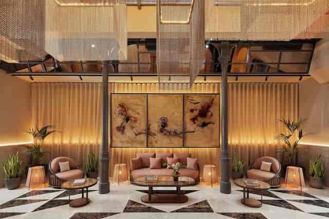 Stylish lounge in NH Collection Madrid, perfect for networking and informal meetings.