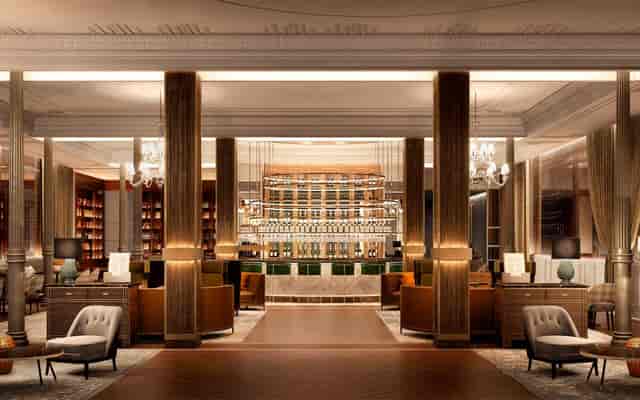 Elegant event space with plush seating at Gran Hotel Inglés for networking and receptions.