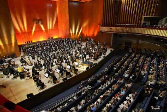 Teatro Monumental concert hall with vibrant audience awaiting orchestra performance.