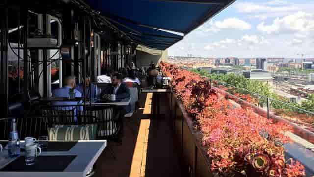 Séptima Rooftop at Only YOU Hotel Atocha, vibrant flowers, ideal for networking events.