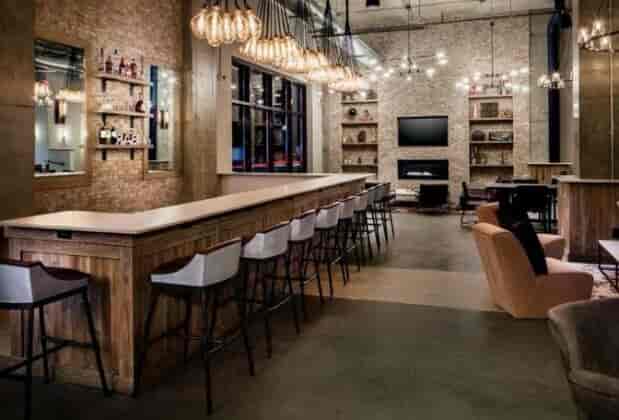 Industrial-chic bar at Watt Hotel Rahway, ideal for networking and upscale events.