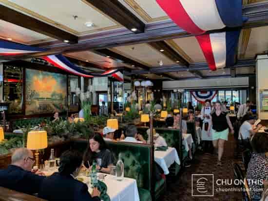Bar at Old Ebbitt Grill with plush seating, ideal for gatherings and dining events.