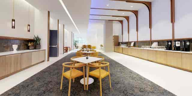 Modern event space reception area with sleek design, ideal for networking and meetings.