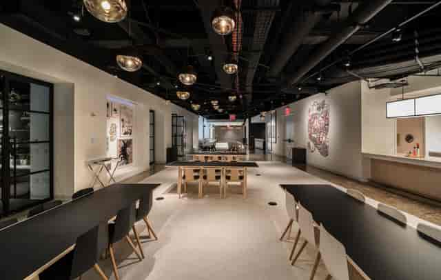 Modern event space with flexible seating for meetings and networking gatherings.