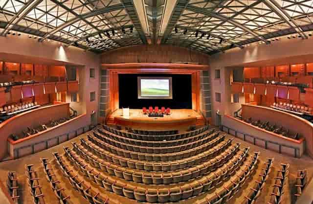 Spacious auditorium with tiered seating at Ronald Reagan Convention Center for events.