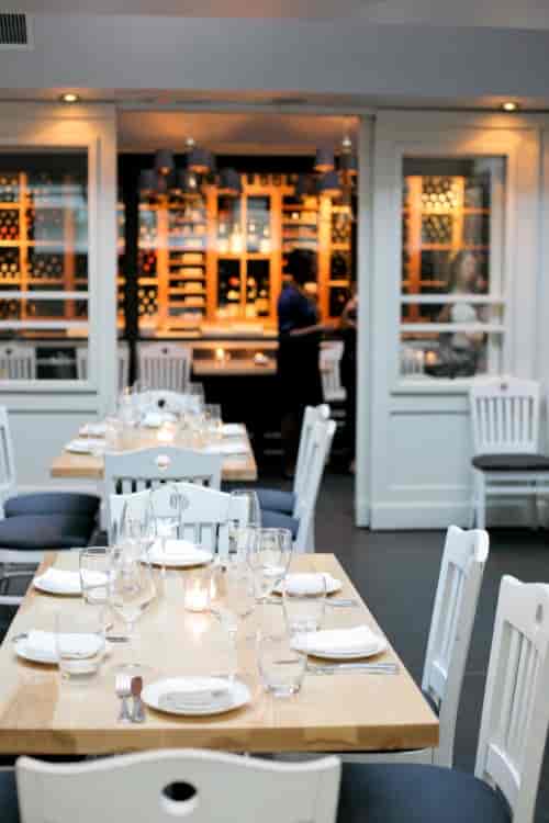 Elegant dining area at L'Artusi's mezzanine, ideal for gatherings and corporate events.