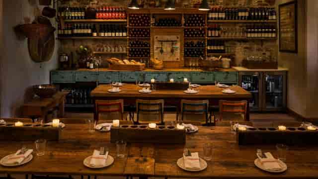 Cozy dining room with rustic decor at il Buco Alimentari for intimate events and wine tastings.