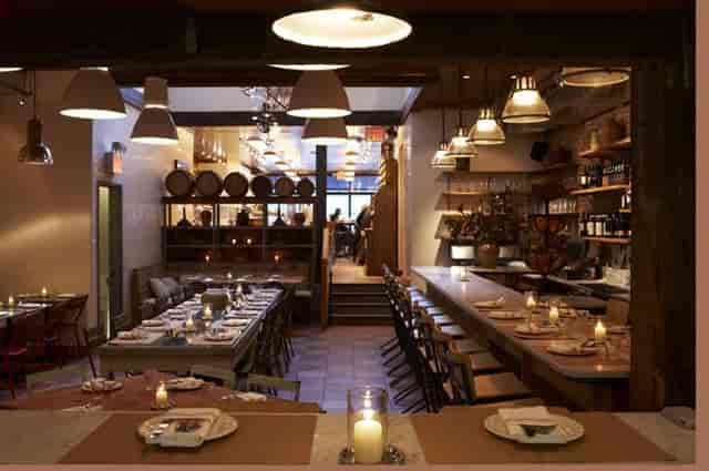 Stylish dining room with warm ambiance, perfect for intimate events and meetings.