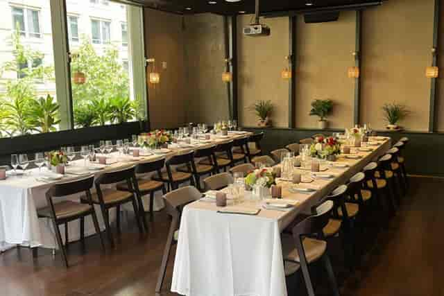 Elegant dining setup in John Carroll Room, perfect for networking events or dinner parties.