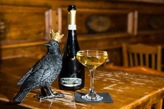 Karaoke night at The Crown & Crow with Prosecco and elegant decor for upscale events.