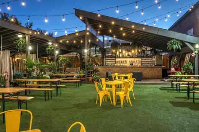 Garden area at Hook Hall with string lights, perfect for casual gatherings and events.