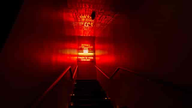 Illuminated red hallway in Jaleo, ideal for networking events and gatherings.