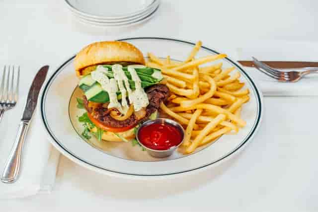 Gourmet burger platter for networking events at The Daily Grill's semi-private space.