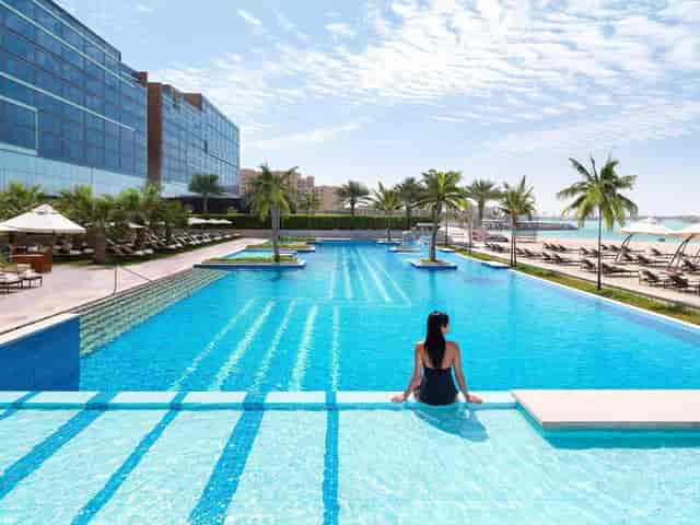 Luxury resort pool deck at Fairmont Bab Al Bahr for events and corporate retreats.