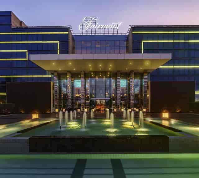 Sleek hotel entrance at night, featuring modern architecture for upscale events in Abu Dhabi.