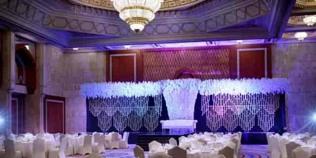 Elegant auditorium in InterContinental Abu Dhabi, floral decor for formal events.