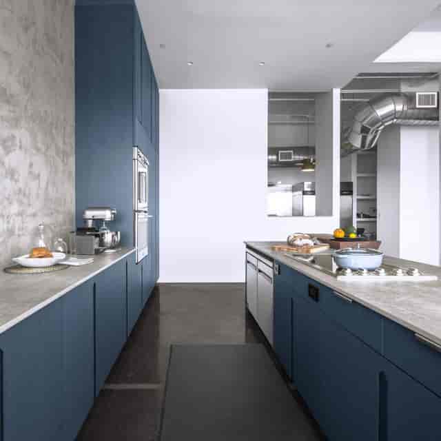 Modern minimalist kitchen for culinary events and cooking demonstrations.