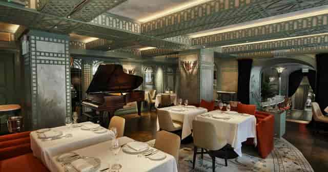 Elegant private dining room in Manhattan Manor with grand piano, perfect for upscale events.