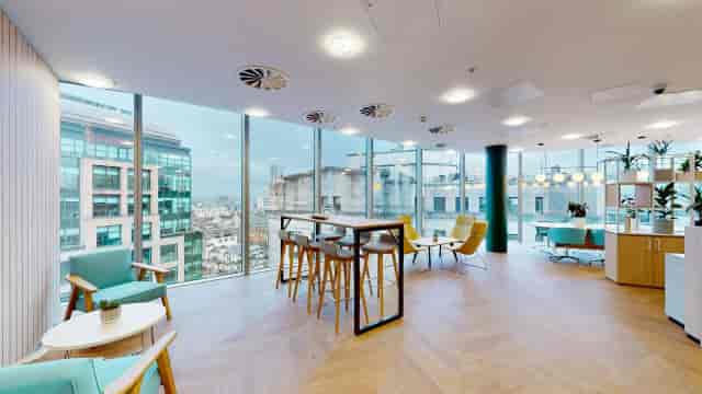 Modern coworking meeting space with large windows in Manchester City Centre.