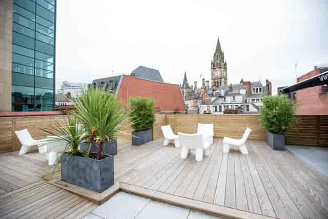 Rooftop meeting room with greenery, perfect for urban networking events in King Street.