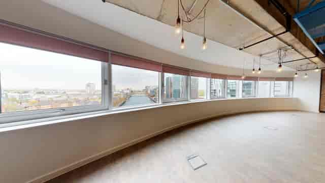 Modern meeting room in Anchorage with panoramic windows, perfect for team sessions and events.