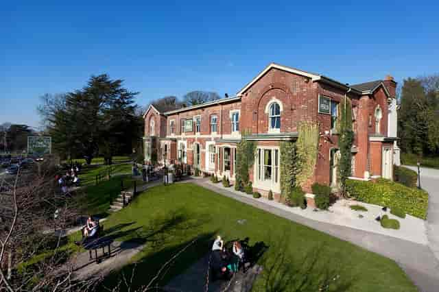Private dining venue with lush outdoor space, perfect for weddings and corporate events.