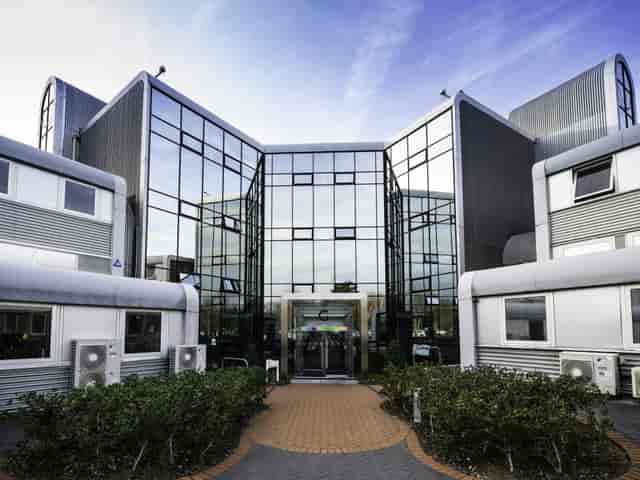 Modern conference room with glass facade at UBC Flexible Offices for corporate events.
