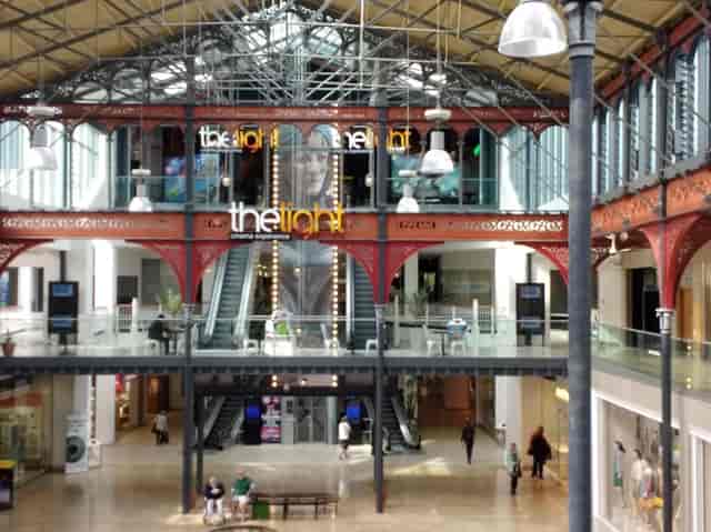 Spacious industrial venue with high ceilings for conferences and social events.