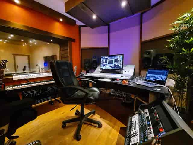 Modern recording studio with advanced audio equipment, perfect for workshops and events.