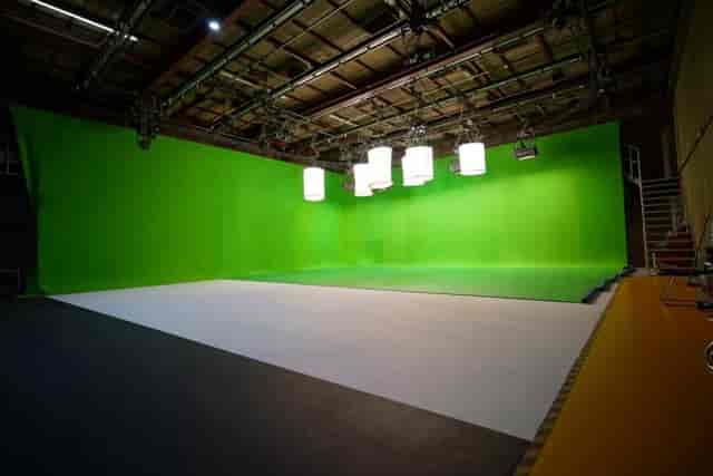 Green Room at Sitcom Soldiers with a large green screen, ideal for video production events.