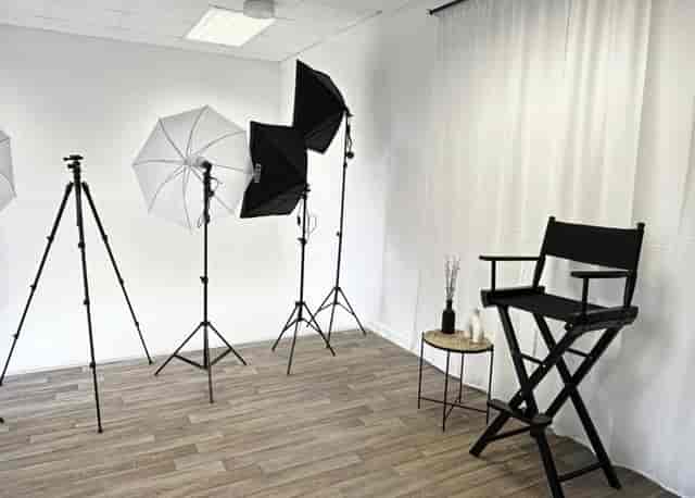Cubed seating boxes in a vibrant studio for interviews and production sessions.