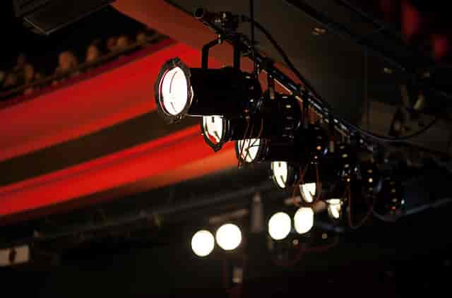 Dance studio with theatrical lighting, perfect for performances and events.