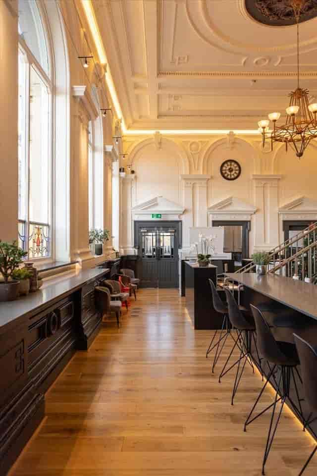 Sophisticated meeting room with high ceilings, ideal for networking events and gatherings.